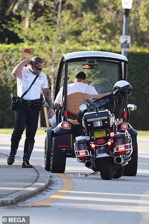 DJ Khaled is pulled over by police in Miami while riding in his golf cart barefoot and handling his phone (Photos)