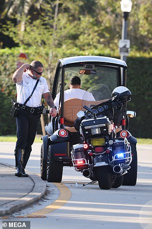 DJ Khaled is pulled over by police in Miami while riding in his golf cart barefoot and handling his phone (Photos)