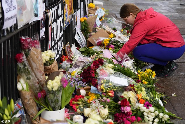 Russia begins jailing hundreds of protesters for laying flowers and candles in memory of ‘murdered’ Putin criticÂ AlexeiÂ Navalny