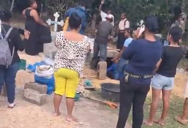 Parents exhume corpse of daughter, 24, out of cemetery after they received a call to her cellphone from someone claimingÂ ‘sheÂ wasÂ alive’ (video)